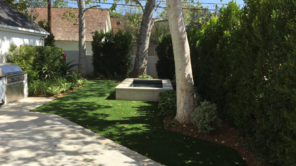 Backyard garden — spa surround, outdoor grill station, mixed tropical border planting