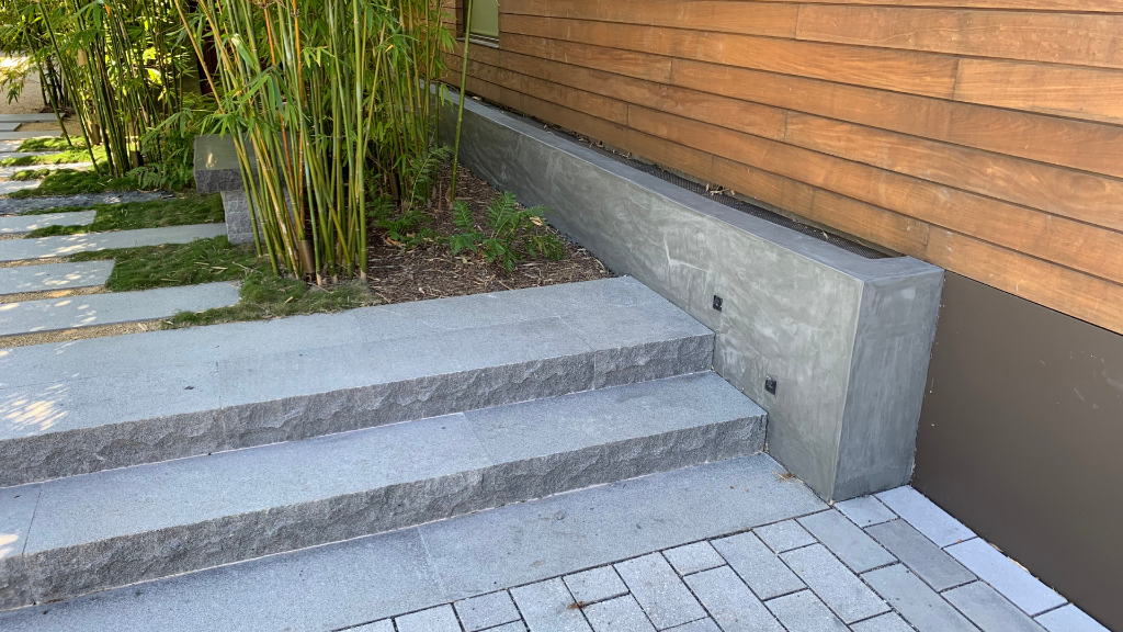 Granite entry steps with integrated lighting channel and bamboo planting
