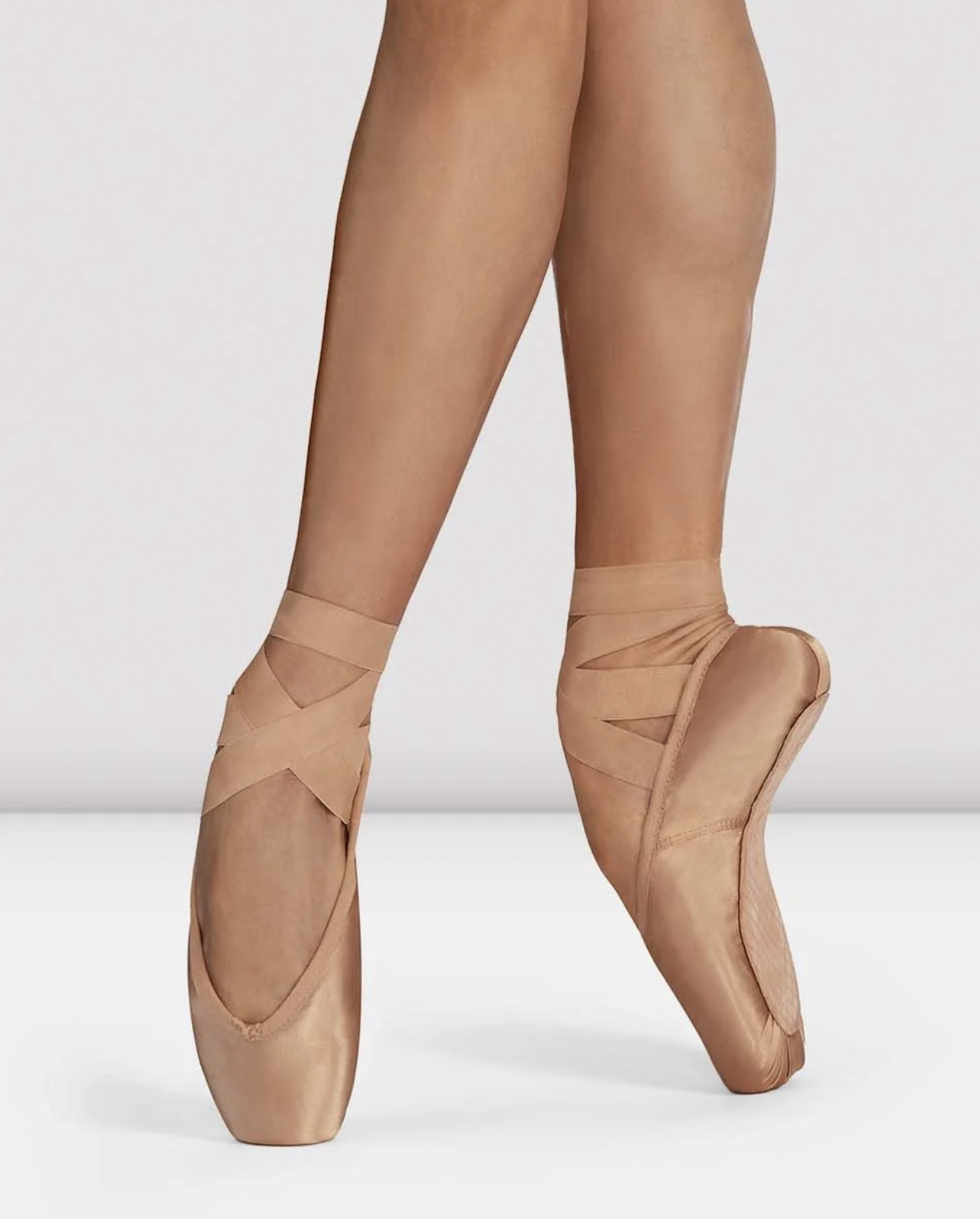 Bloch Heritage pointe shoes, part of the Tonal Pointe Shoe Range, worn en pointe with ribbons tied at the inner ankle
