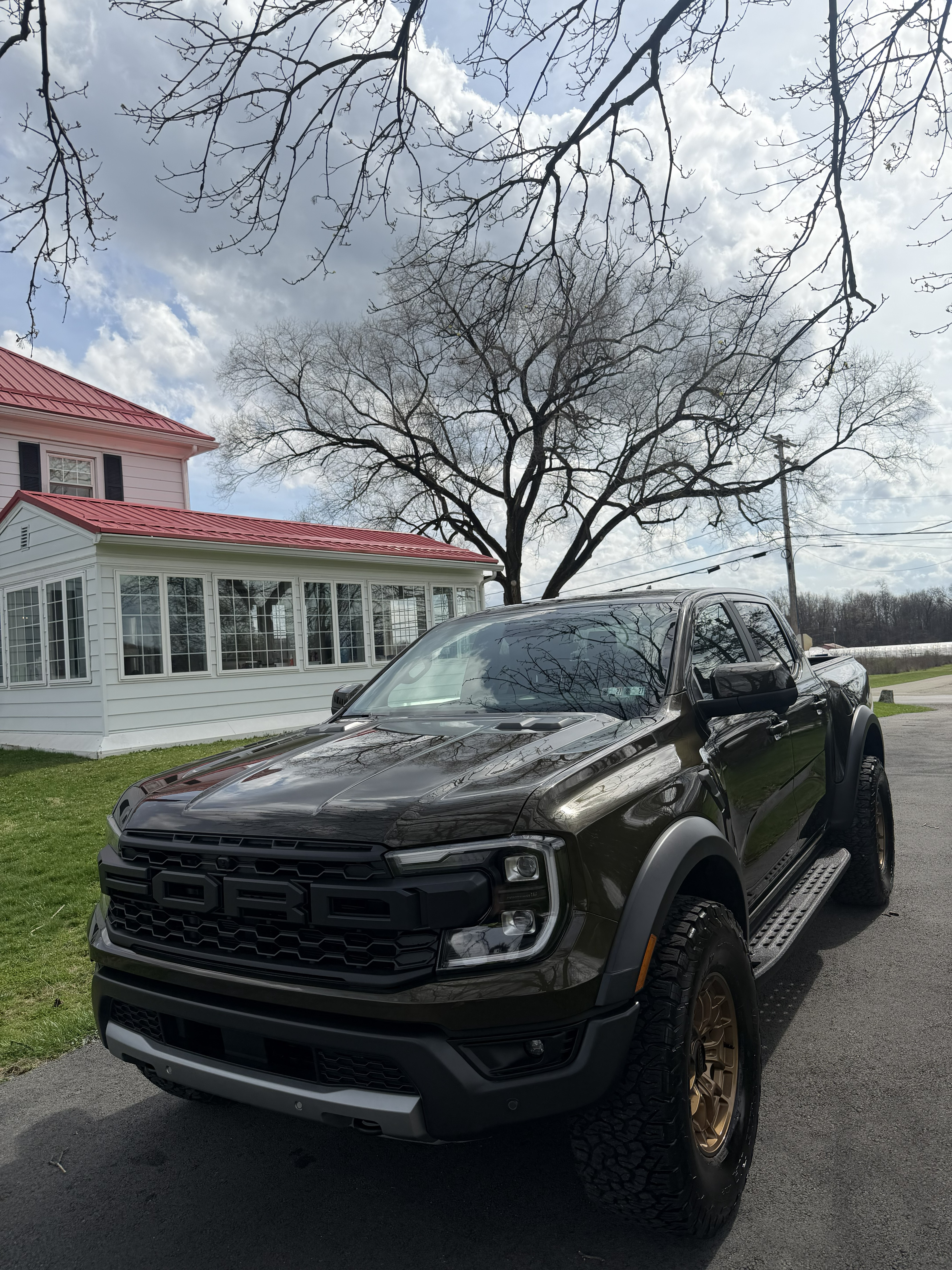 Bronze Ford Ranger Raptor pickup truck detailed by Landen's Mobile Detailing parked on a residential driveway