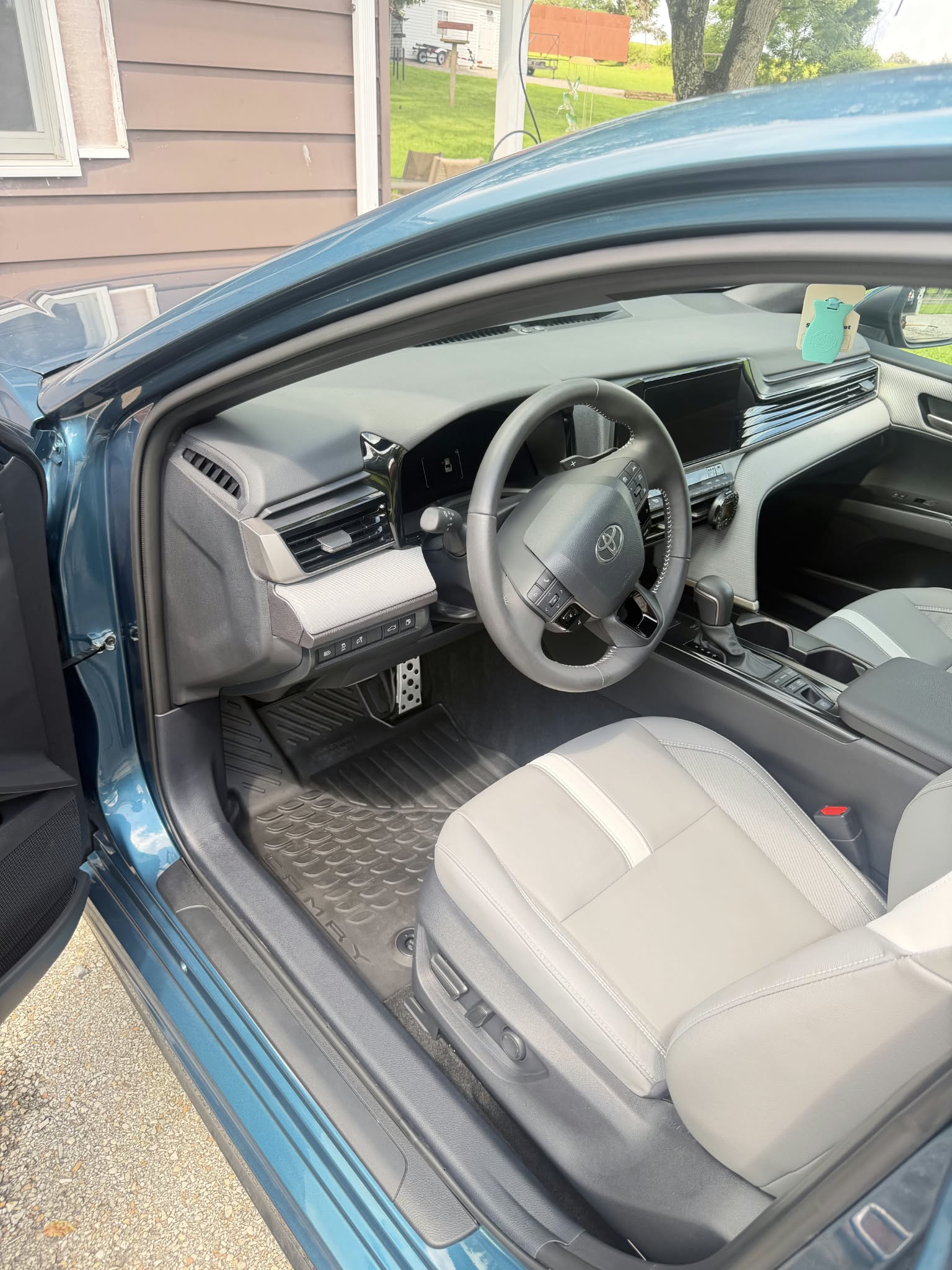 Detailed Toyota Camry interior with driver seat and infotainment screen