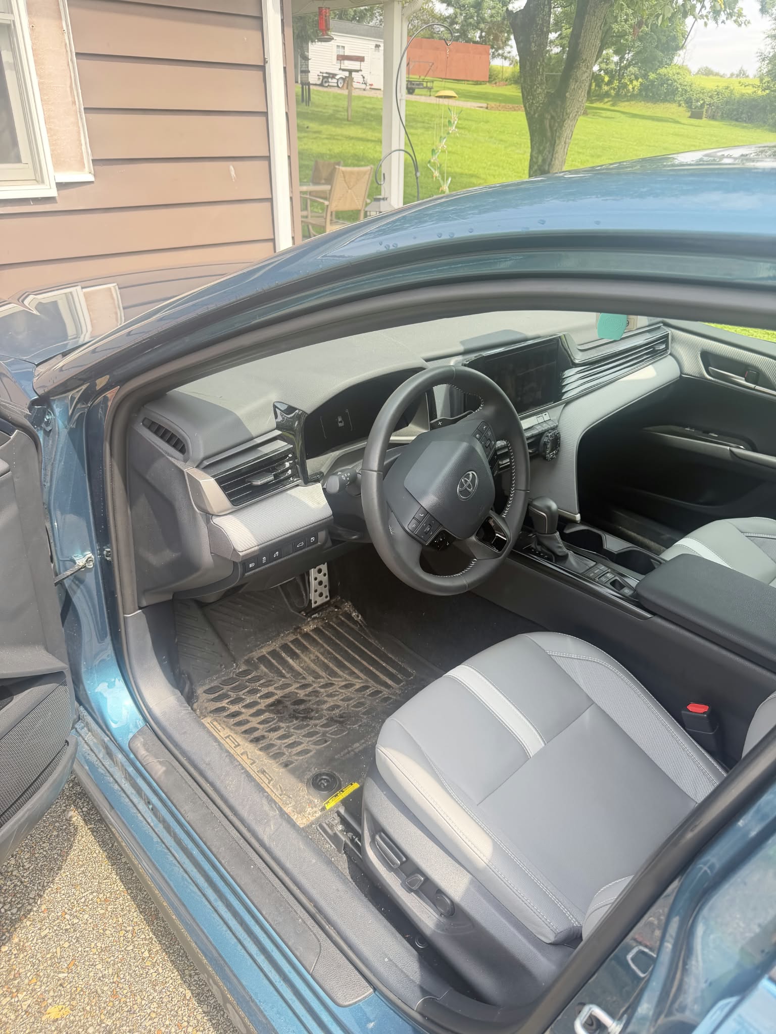 Detailed Toyota Camry interior with leather-trimmed driver seat