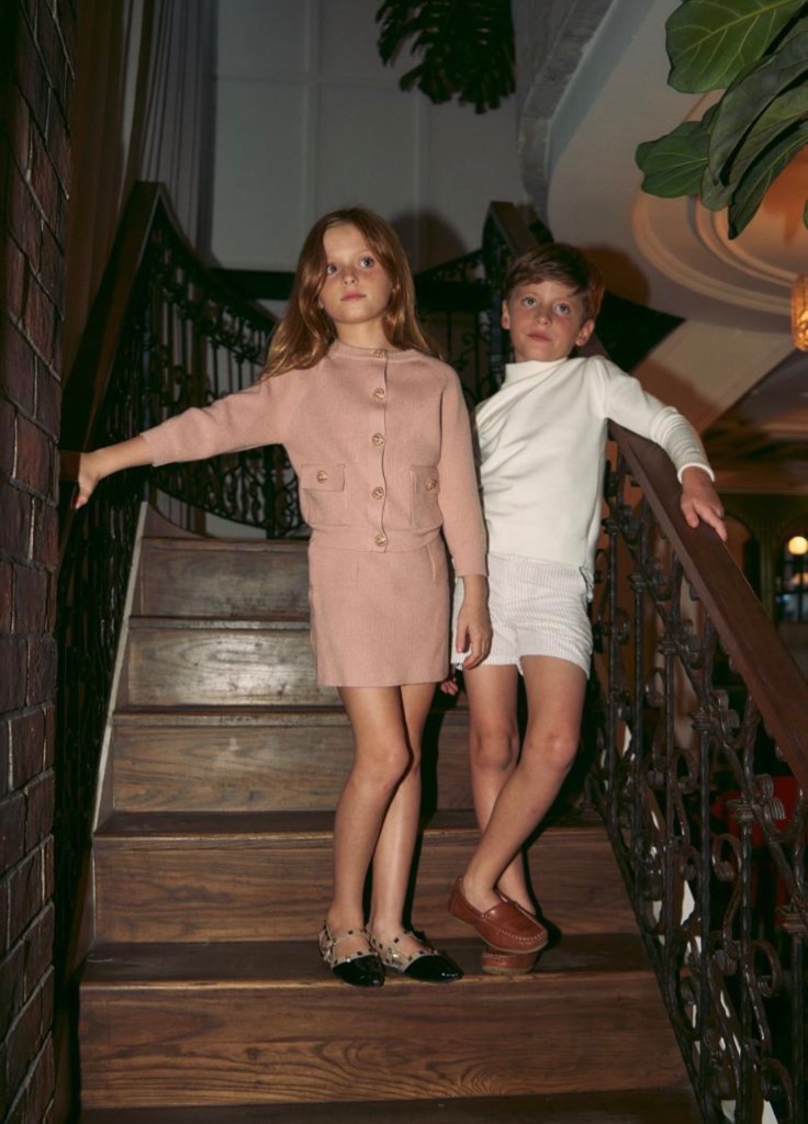 Children on a staircase in knitwear