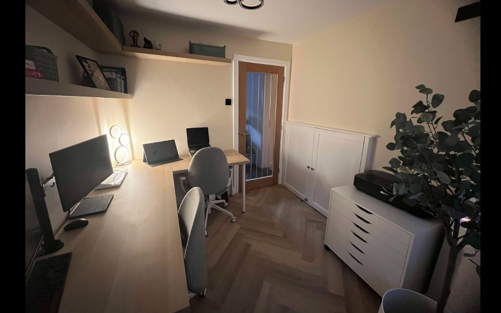 Bespoke home office with fitted shelving and herringbone LVT flooring