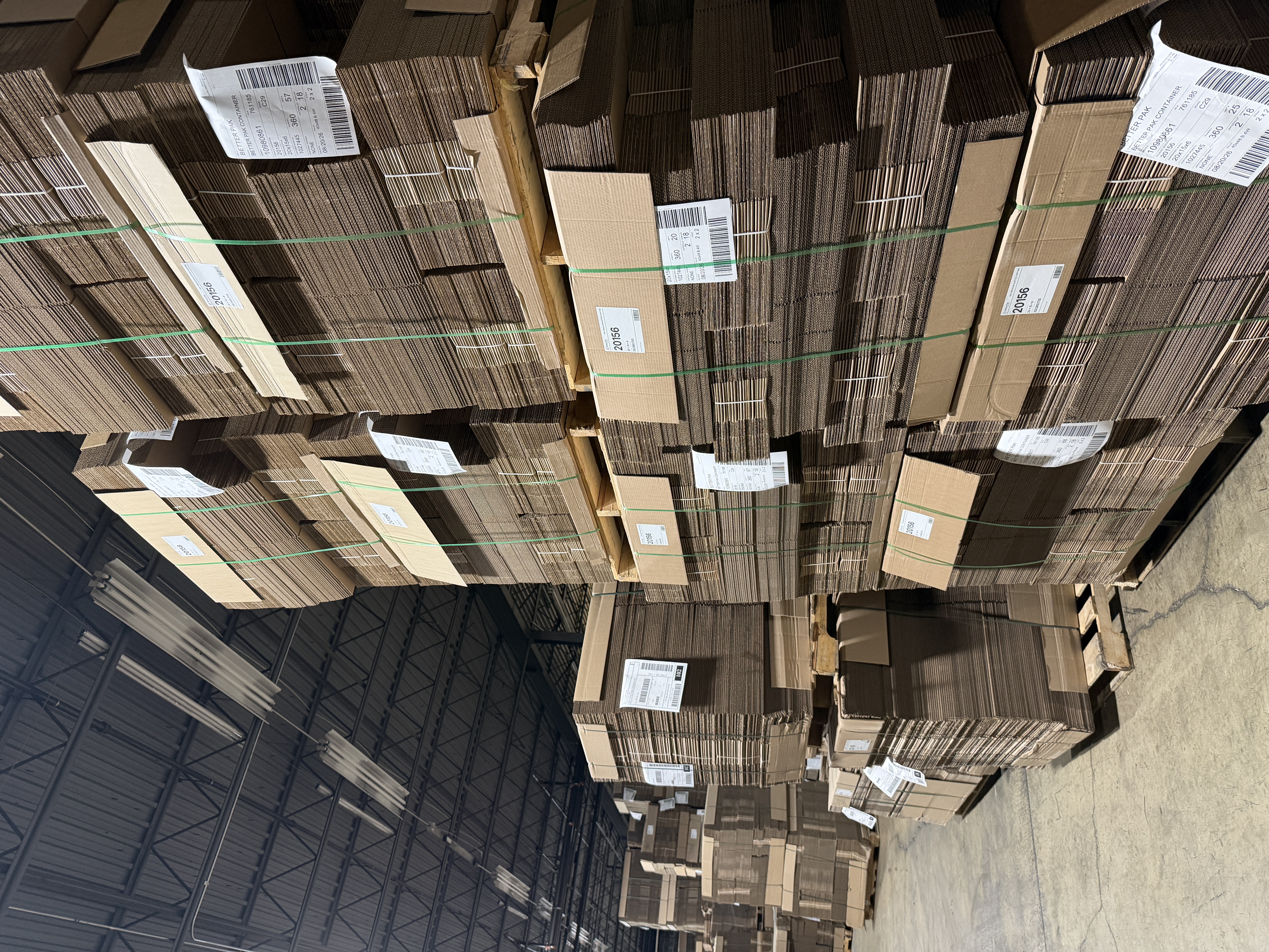 Stacked corrugated box inventory inside the Better Pak warehouse