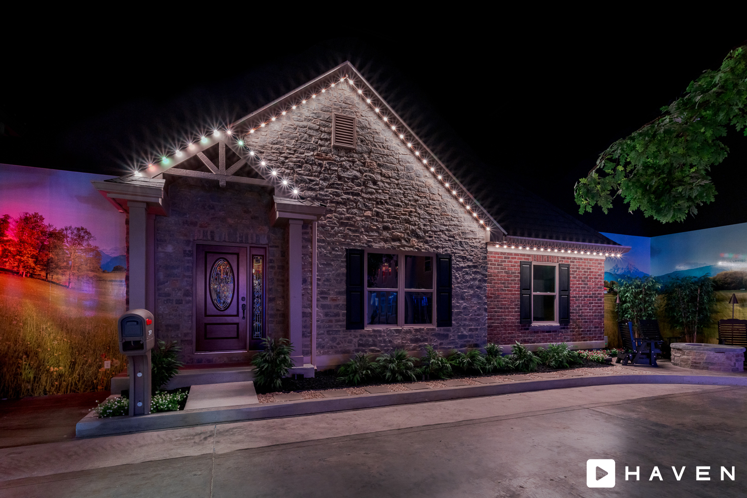 Warm white permanent roofline lighting on a home at night