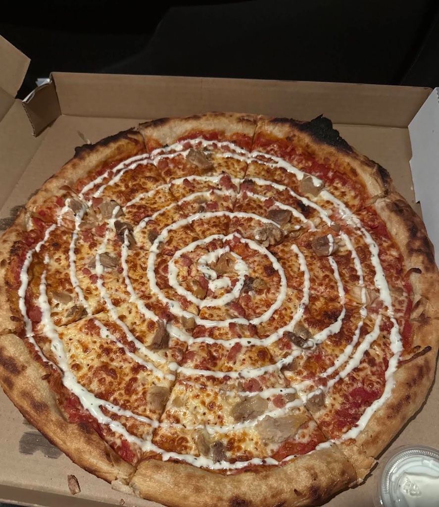 Pizza in a box with cream swirl
