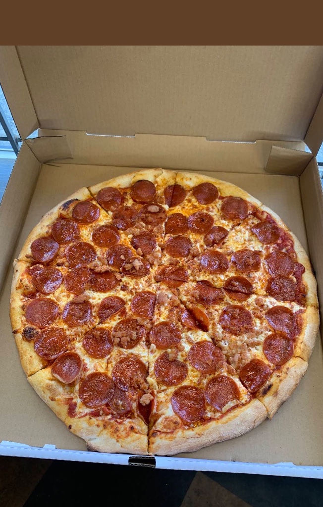Pepperoni pizza in open box