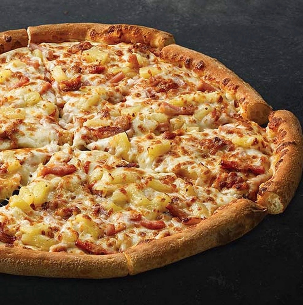 Hawaiian pizza loaded with pineapple and ham