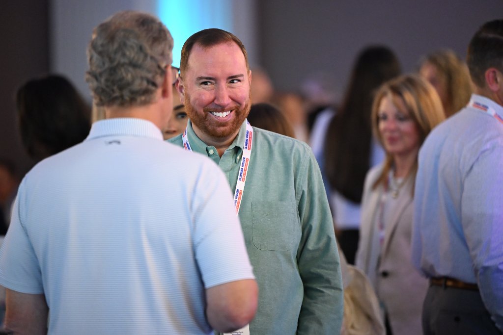 Attendees networking at a corporate conference event