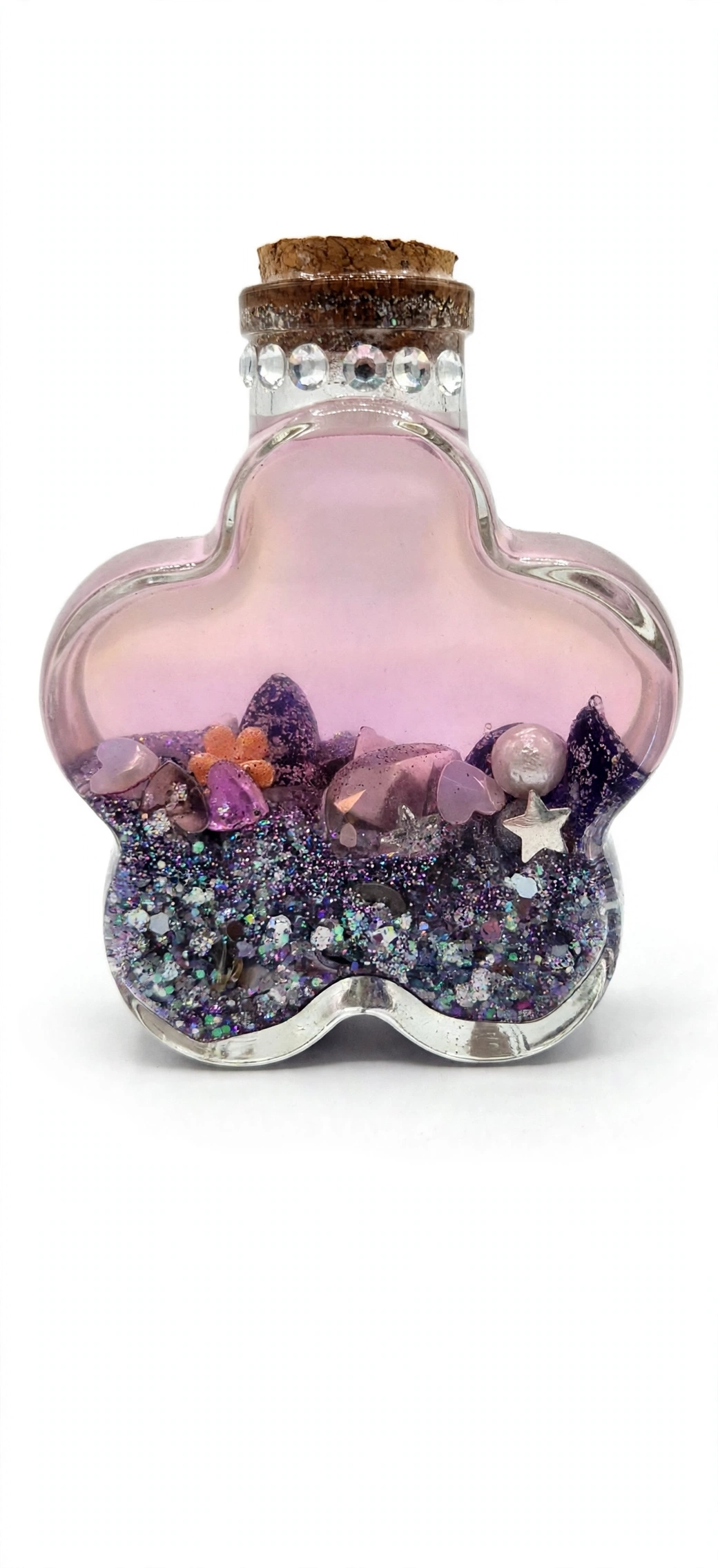 Wildflower manifestation potion bottle in rose with pink-purple glitter and stars for an intention-setting ritual