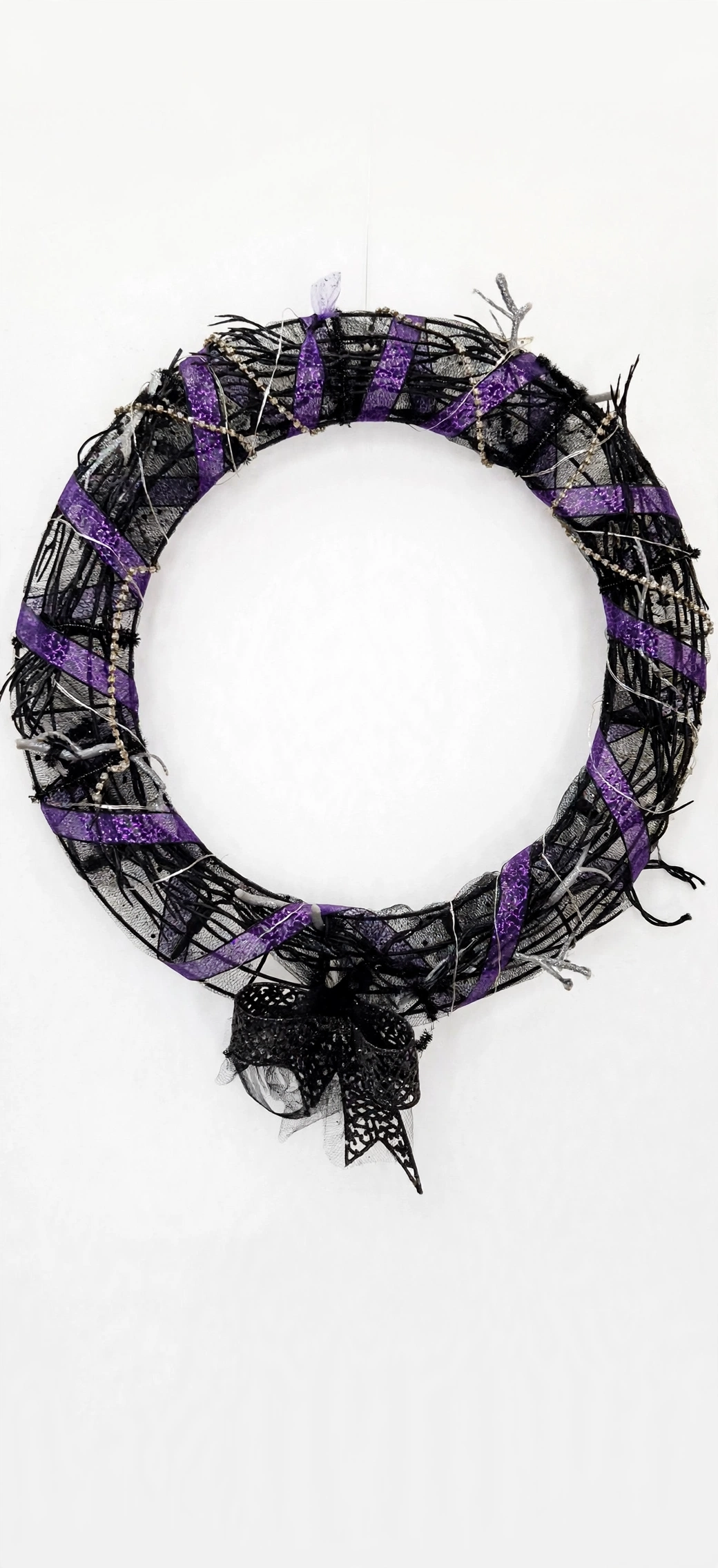 Midnight magic ritual wreath with purple glitter ribbon and black lace for seasonal ritual decor