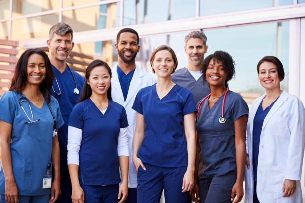 Dark-skinned African American female nurse smiling confidently