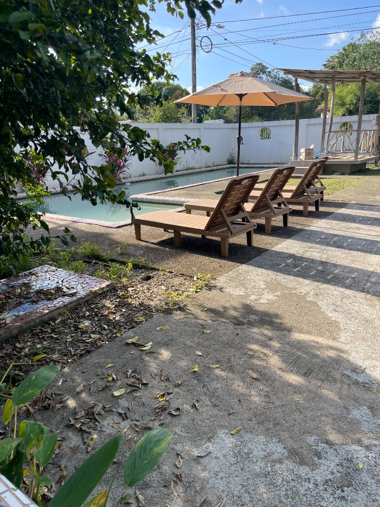Crown Jewel Eco Villa pool and lounge area in Belize