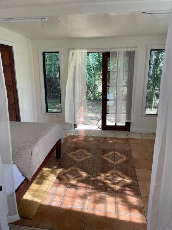 Bedroom with French doors opening to garden