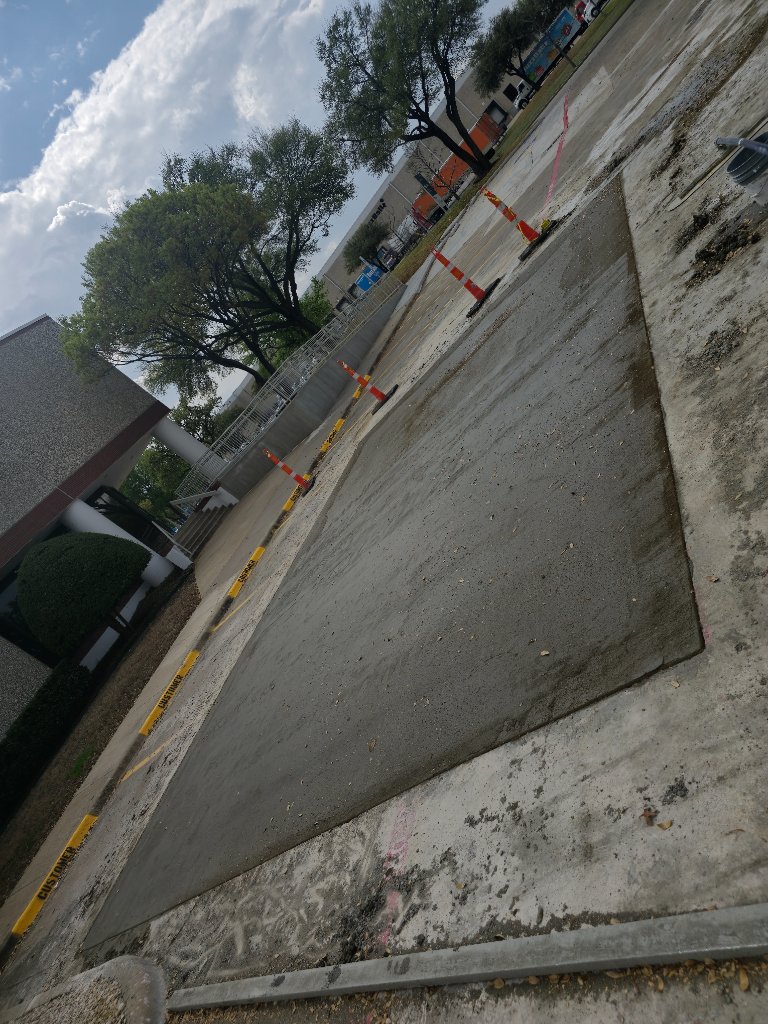 Freshly poured concrete patch at loading dock