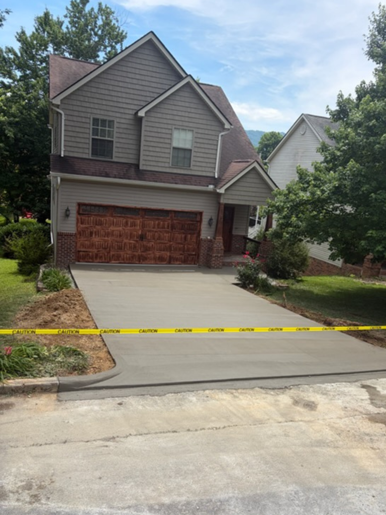 Completed concrete driveway project by K&H Concrete Services