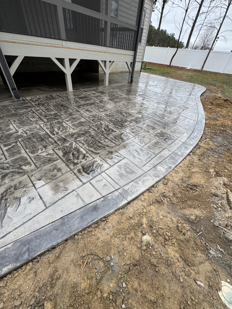 Side by side comparison of broom finish and slick finish concrete