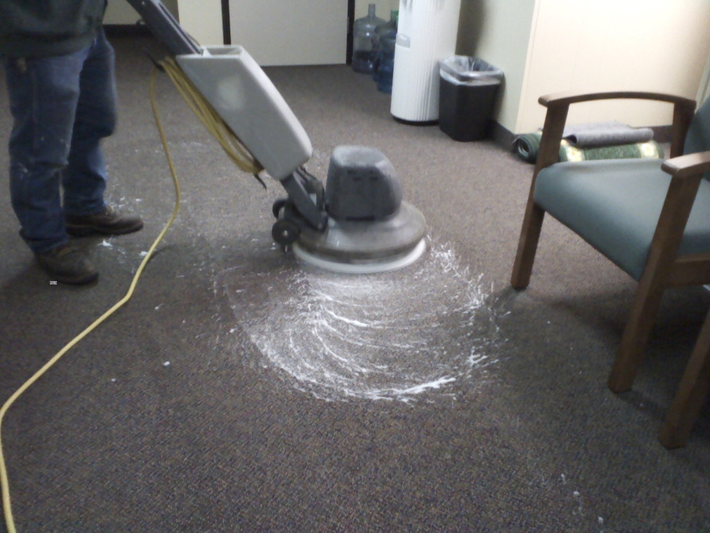 Professional carpet cleaning equipment in action on residential carpet