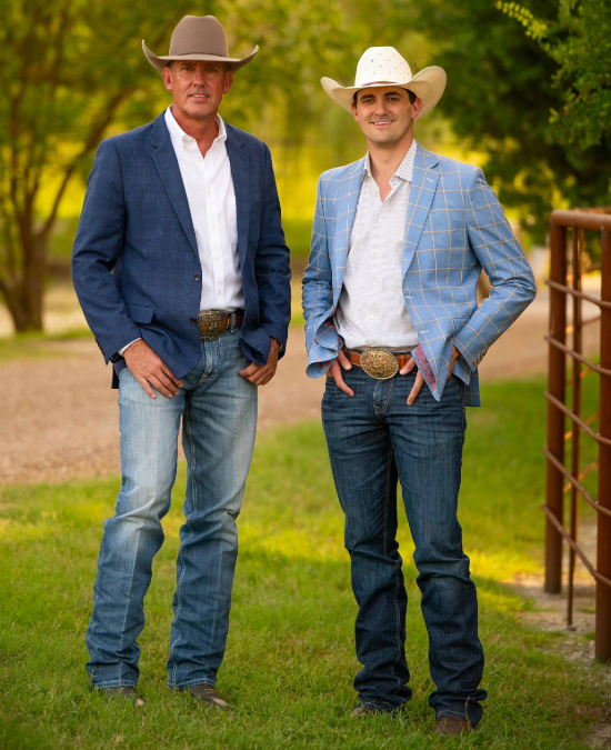 David and Cody Inman standing full-length in ranch pasture at golden hour