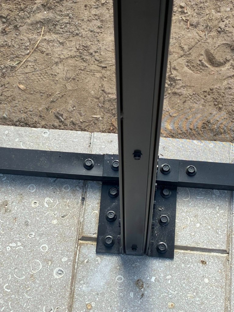 Pool enclosure base installation