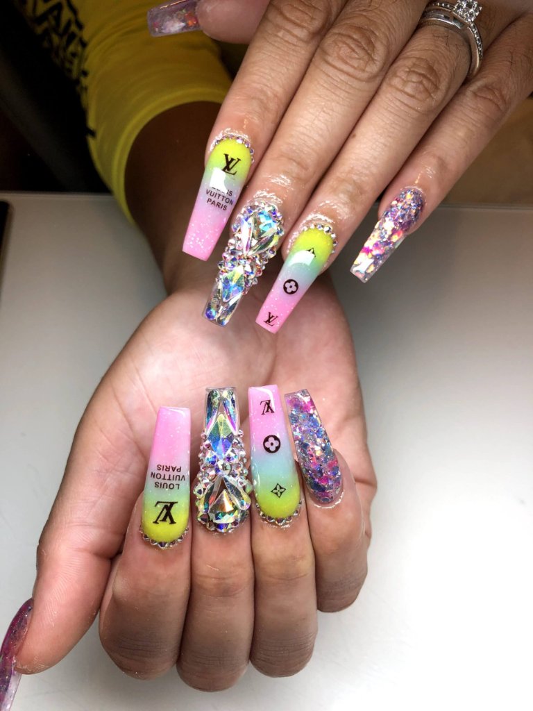 Nail technician performing detailed nail work
