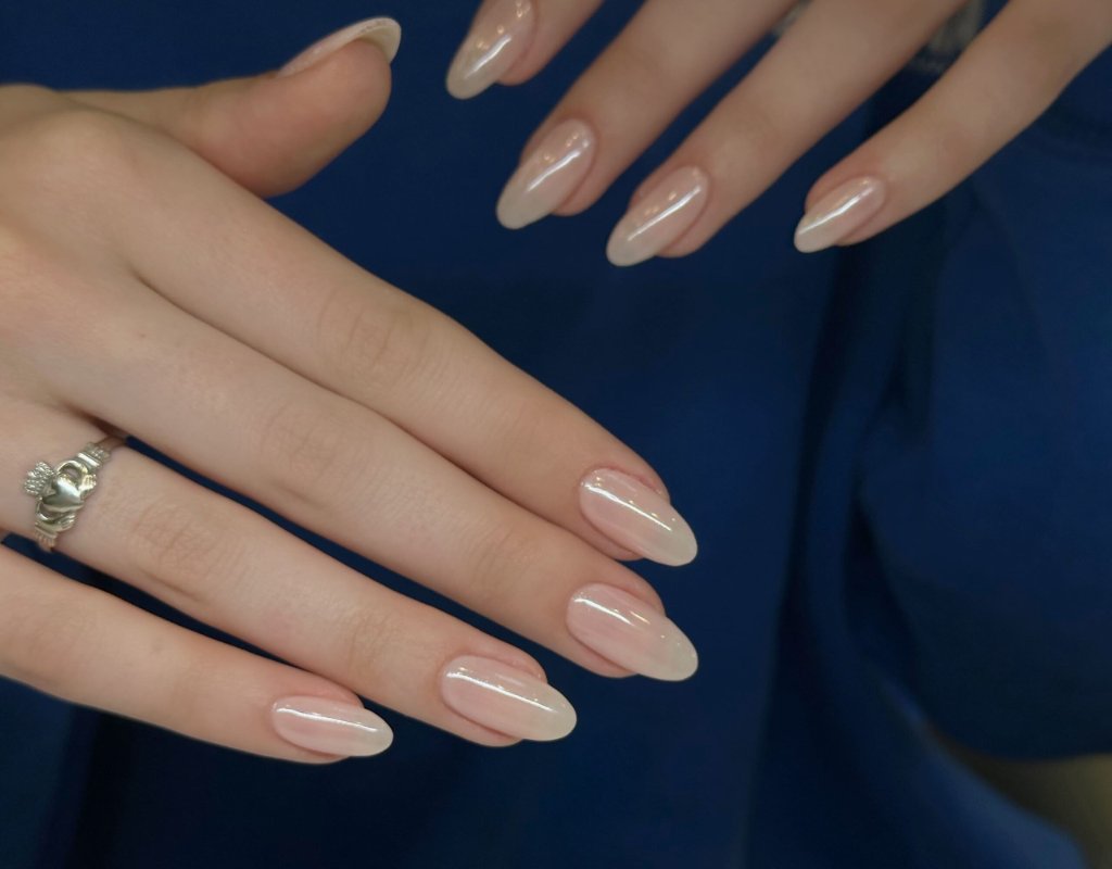 Gel-X nail extensions in a nude glam finish