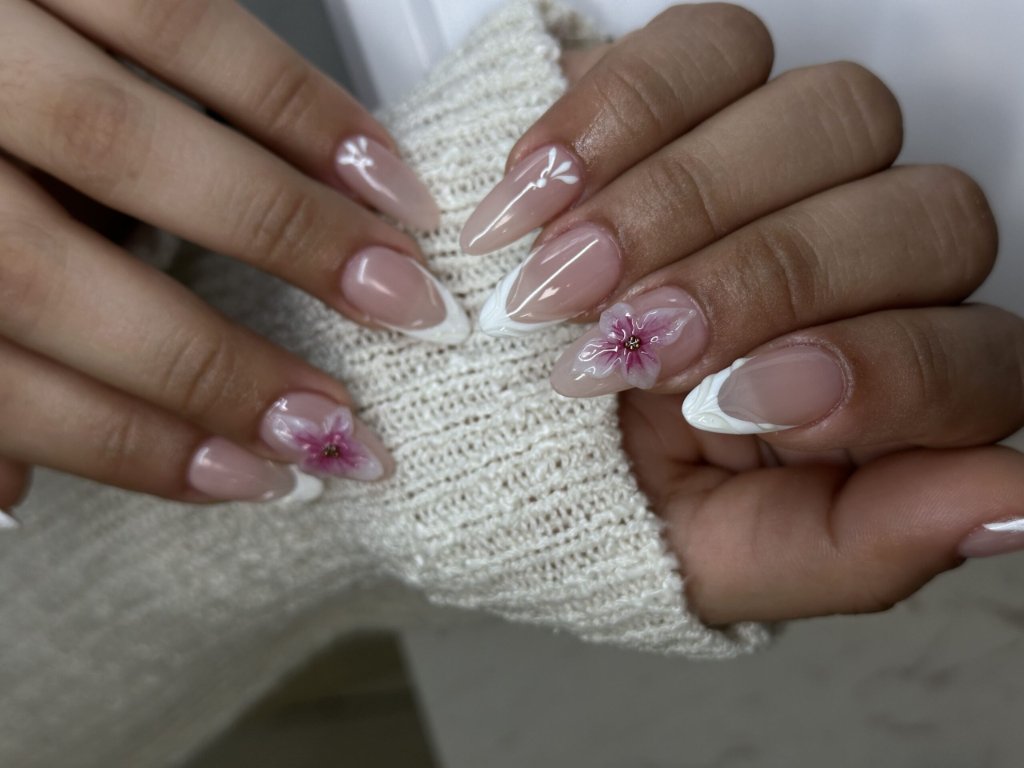 Custom nail art with a floral French design