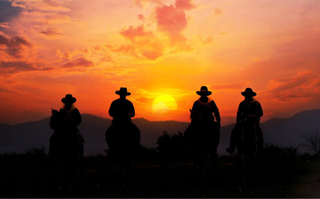 Cowboys at sunset