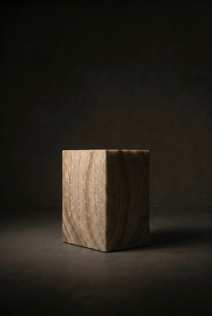 Solid banded onyx cube pedestal side table on concrete floor