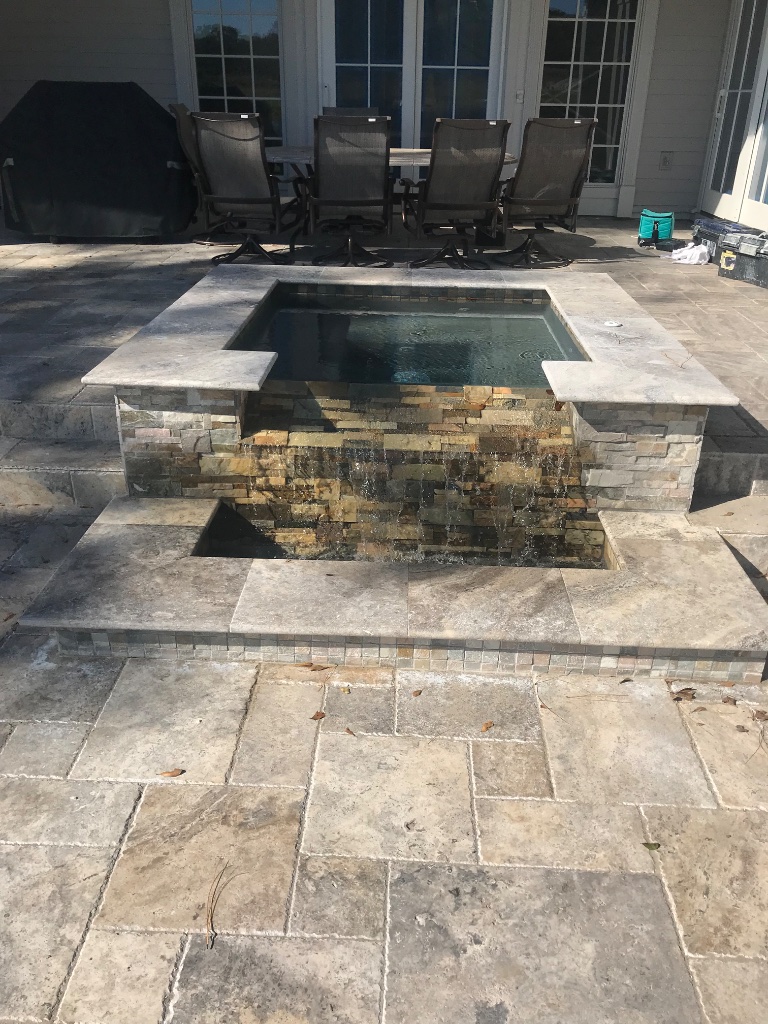 Raised Spa with Stone Spillway