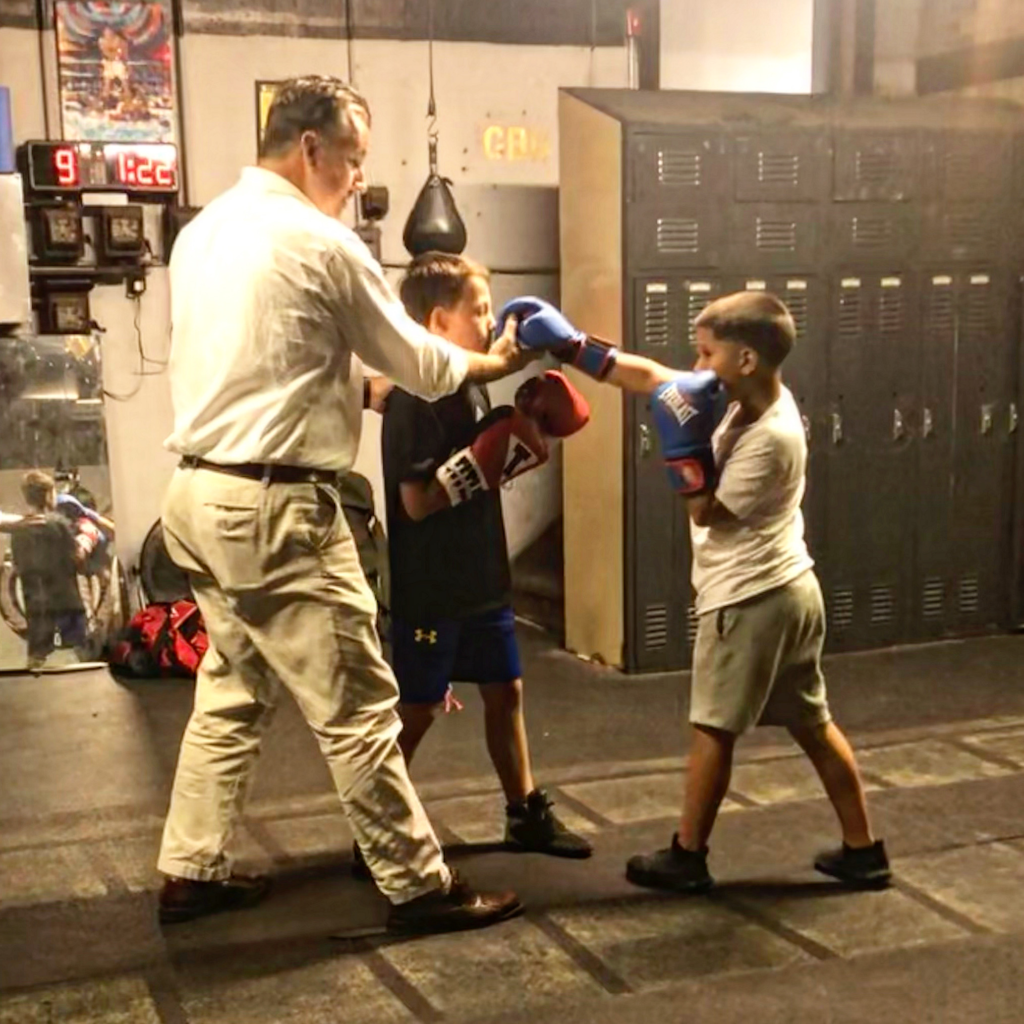 Coach working the mitts