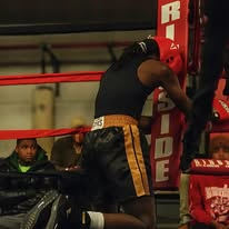 Fighter resting in the corner of the ring