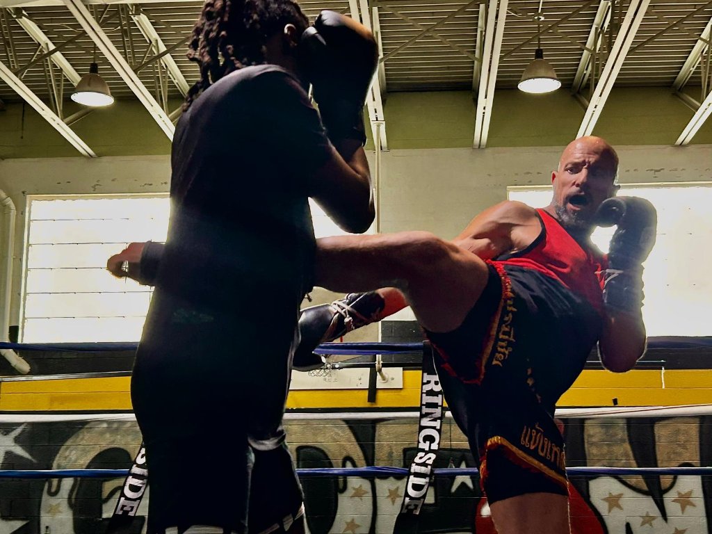 Coach Zac demonstrating technique in the ring