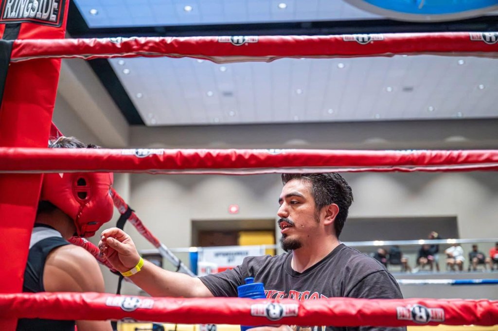 Coach Joe at the red ring ropes