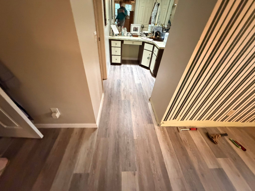 After: Flooring installation in Lecanto FL - old carpet removed and replaced with wood-look vinyl plank