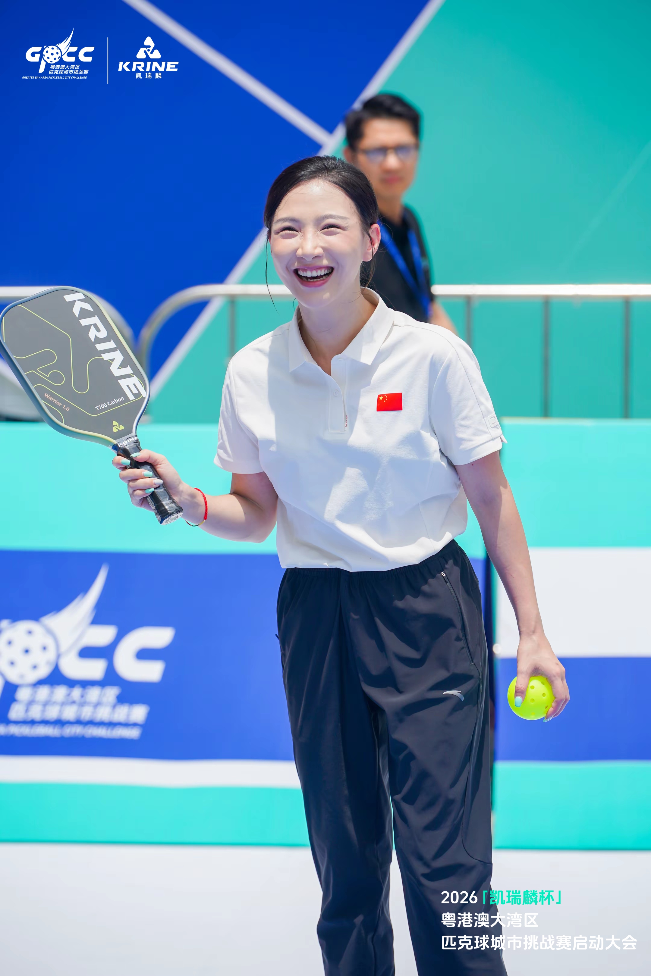 Player holding a paddle and ball at the GPCC launch event