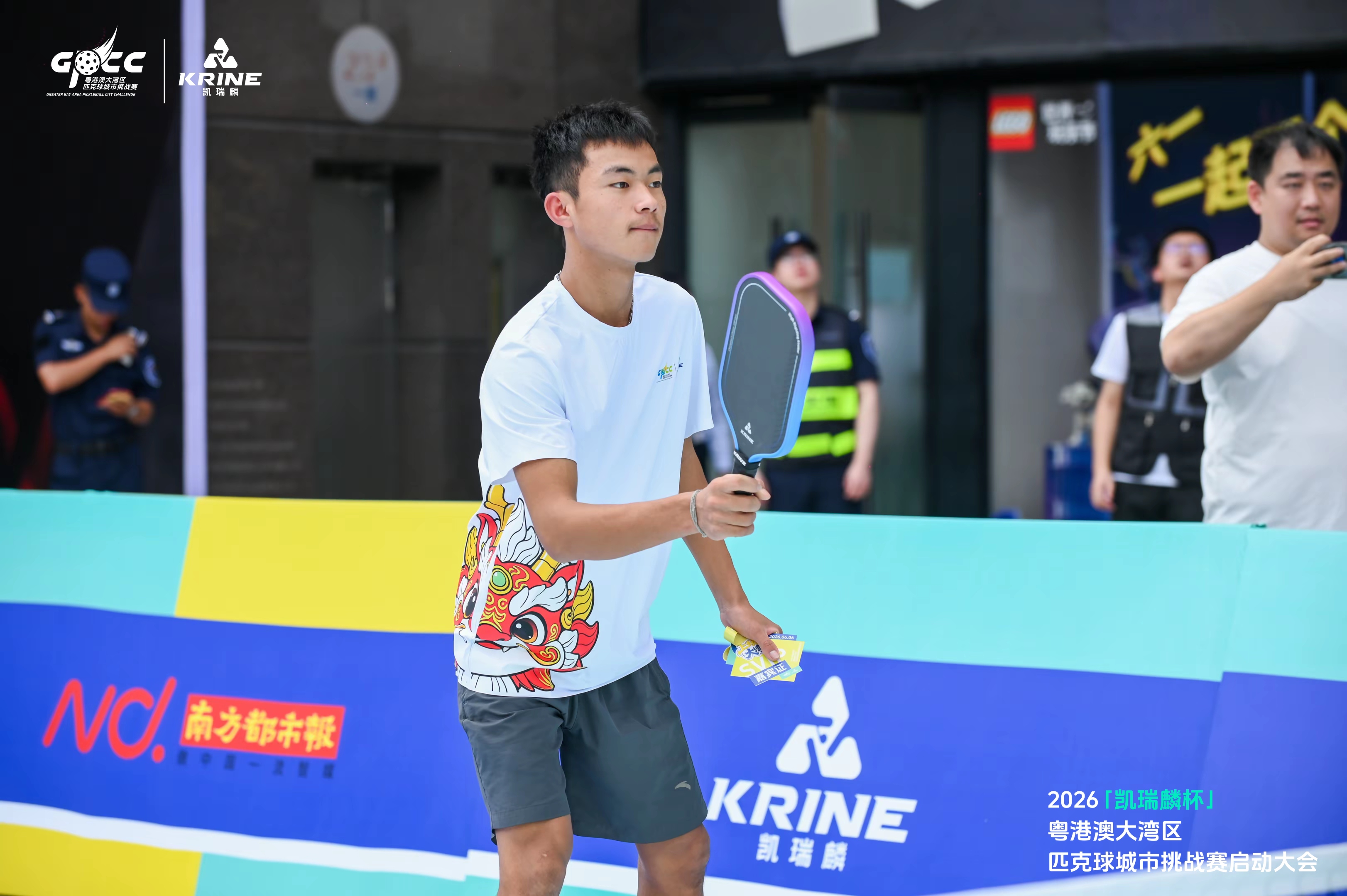 Player in a lion-dance t-shirt during a match