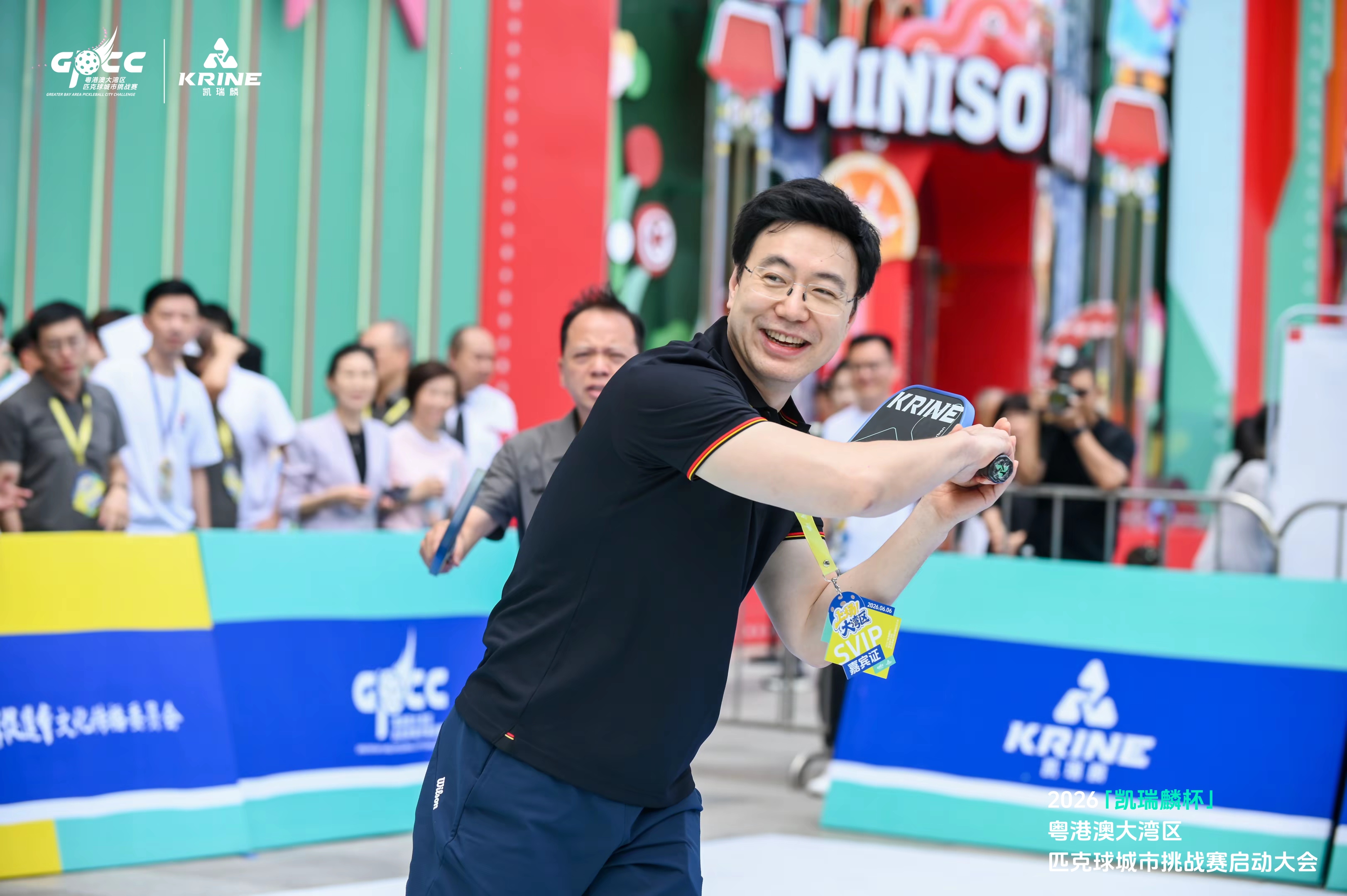 VIP guest mid-swing with a Krine pickleball paddle