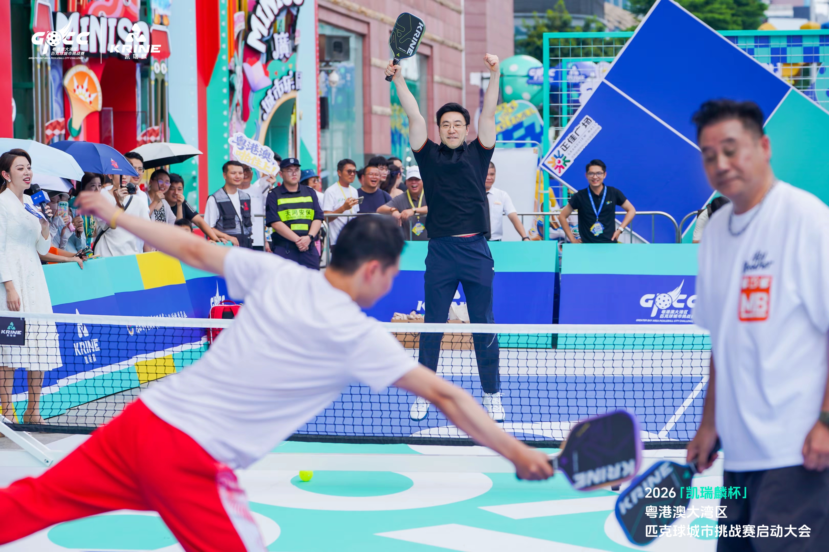 Action shot of a player leaping in celebration on court