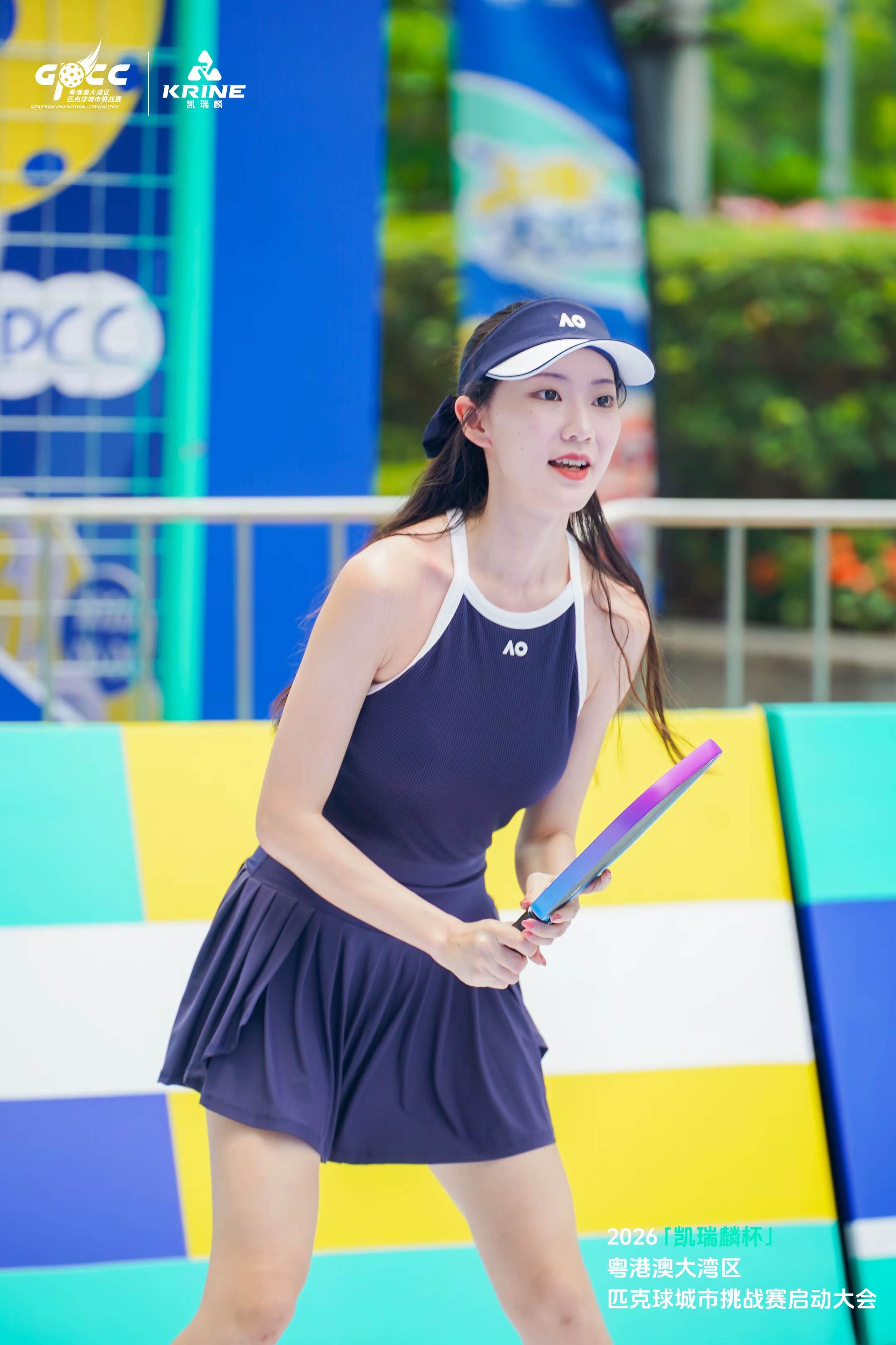 Young player with a pickleball paddle on court