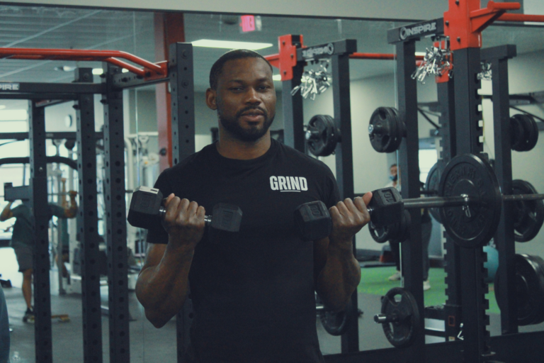 Personal trainer coaching an athlete