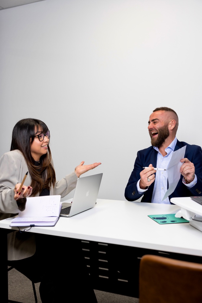 Colleagues collaborating at desk
