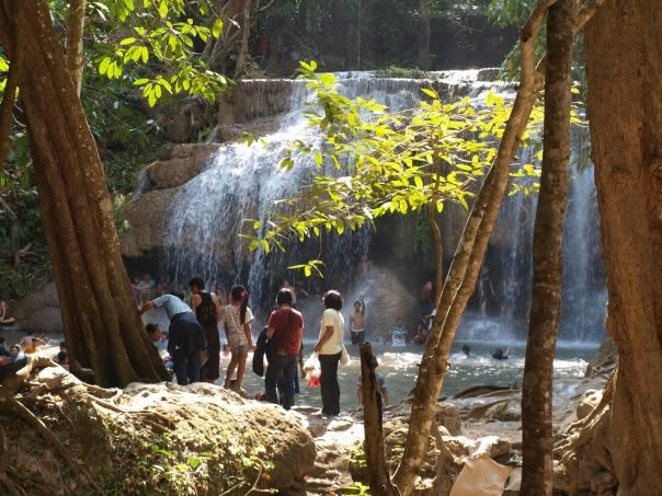 Group of participants at a jungle waterfall in Thailand