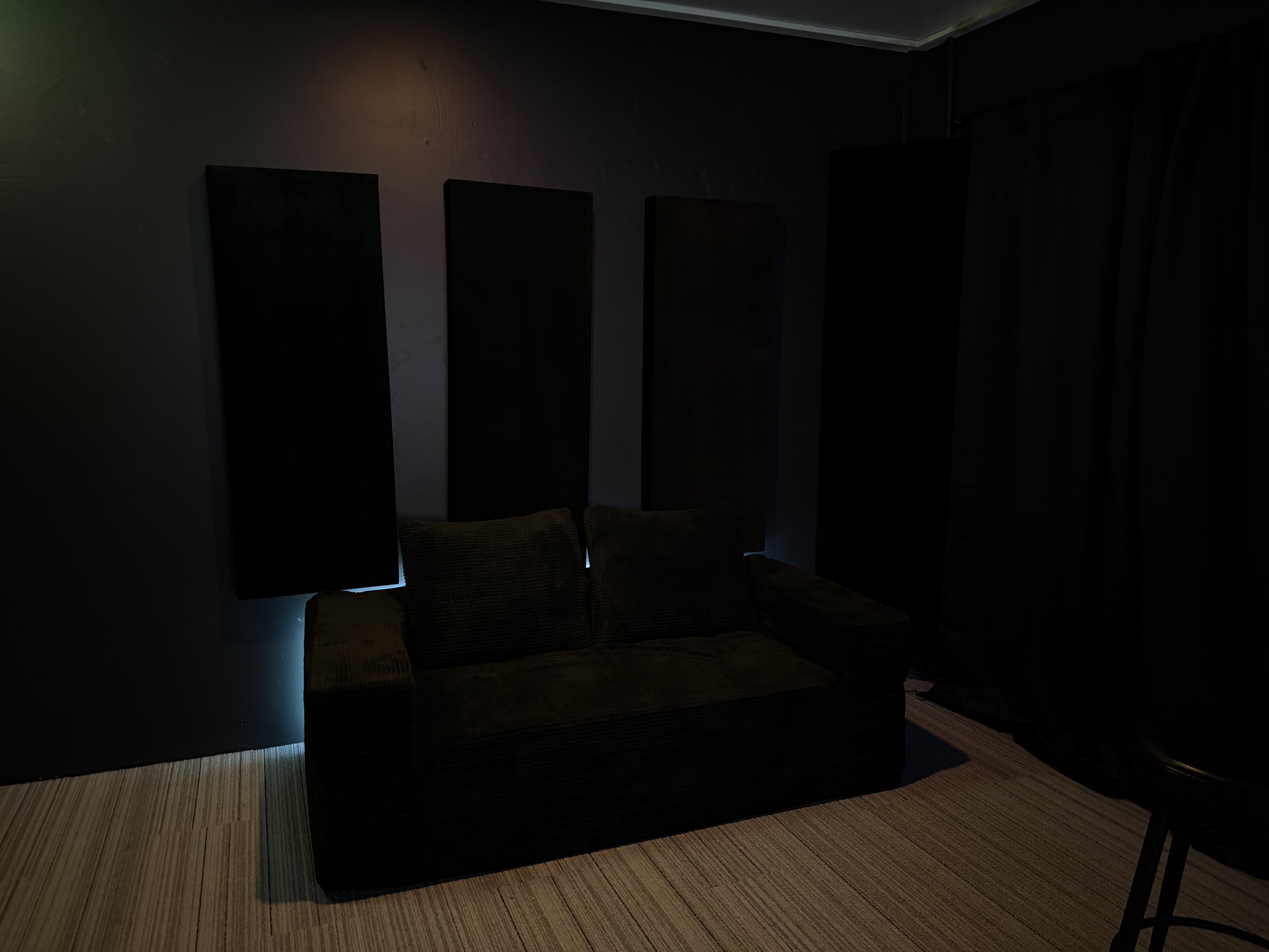 Lounge couch with acoustic panels and LED glow