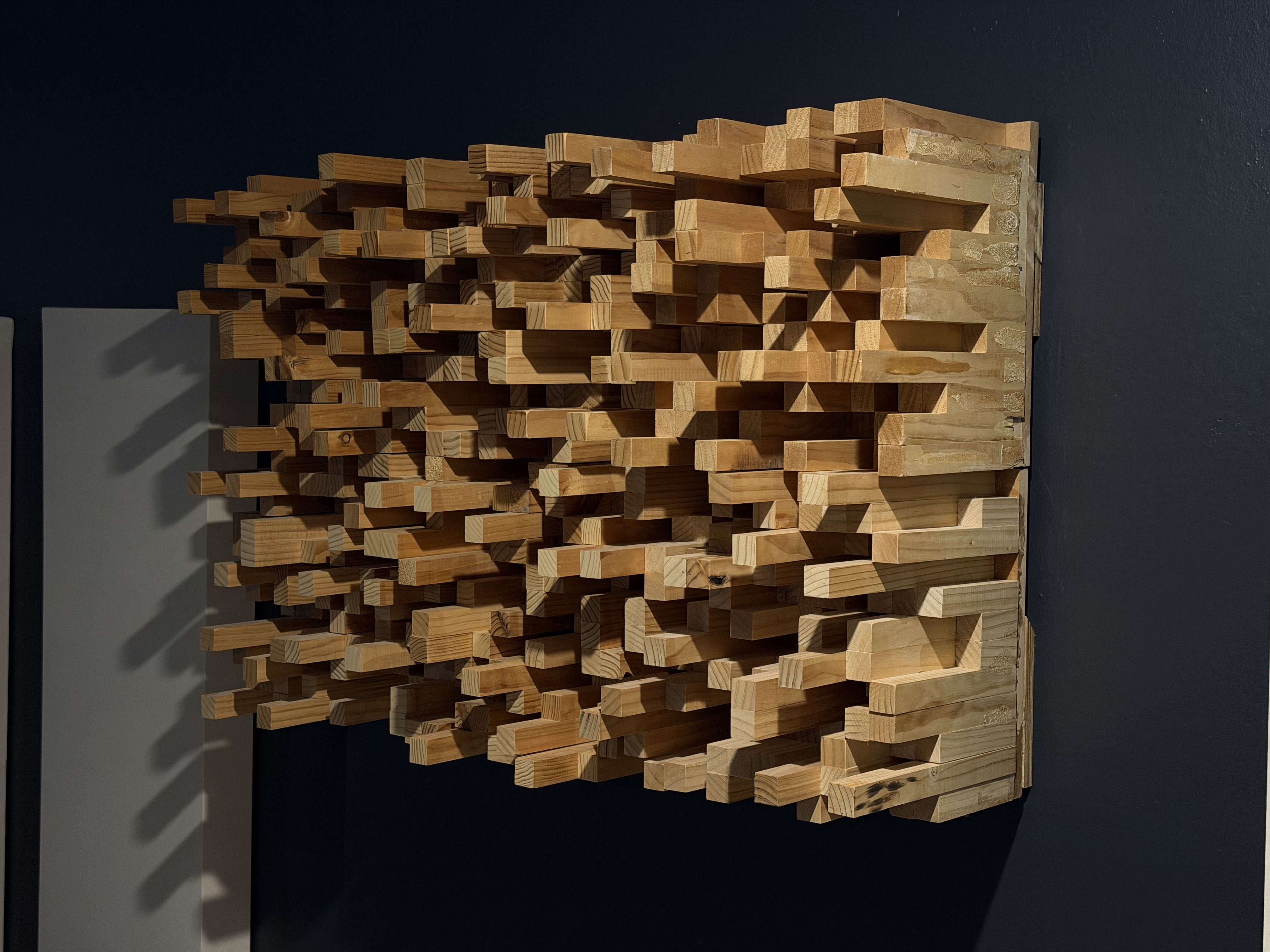 Handmade wooden acoustic diffuser on wall