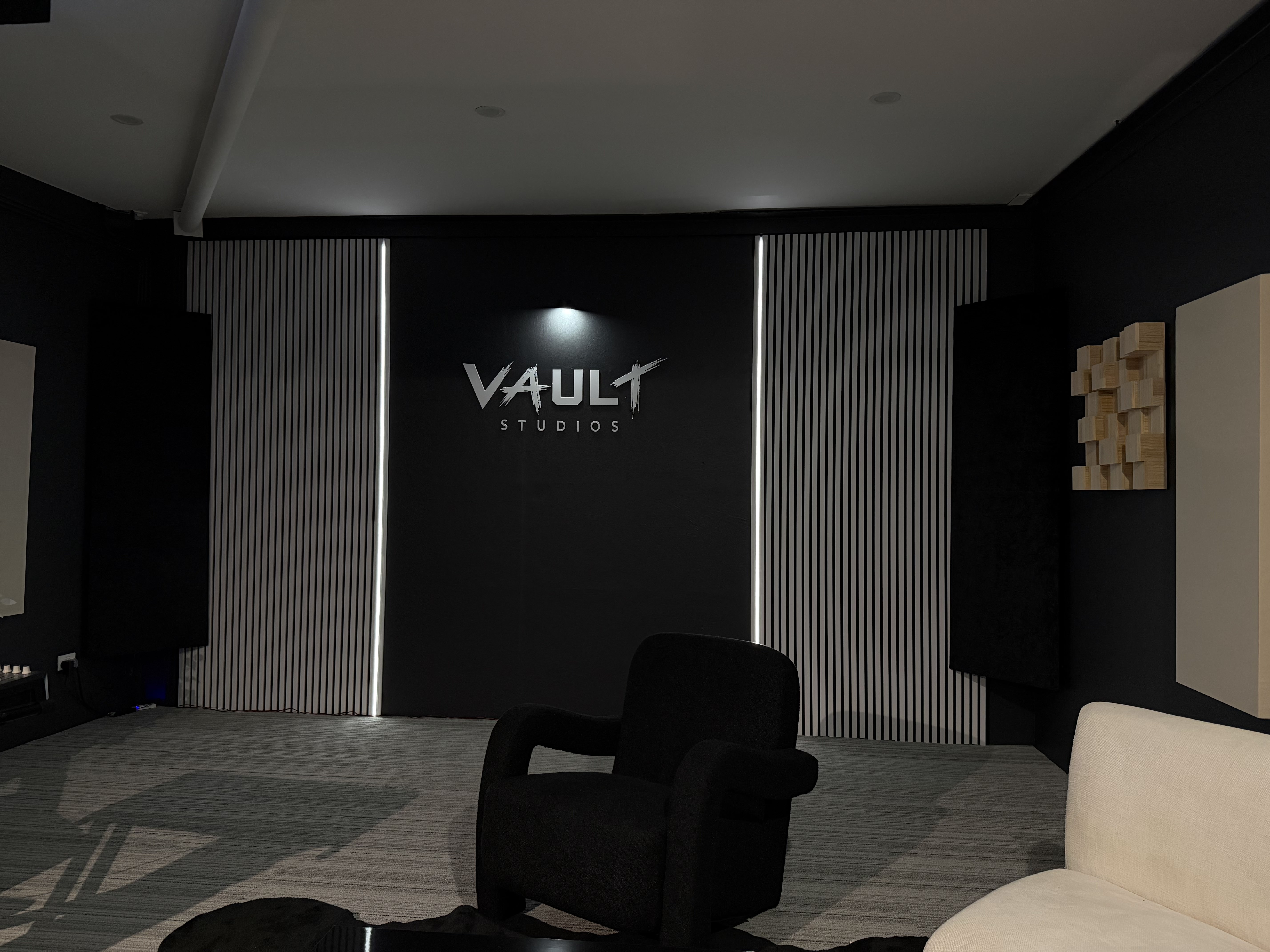 VAULT Studios back wall with light bars and armchair