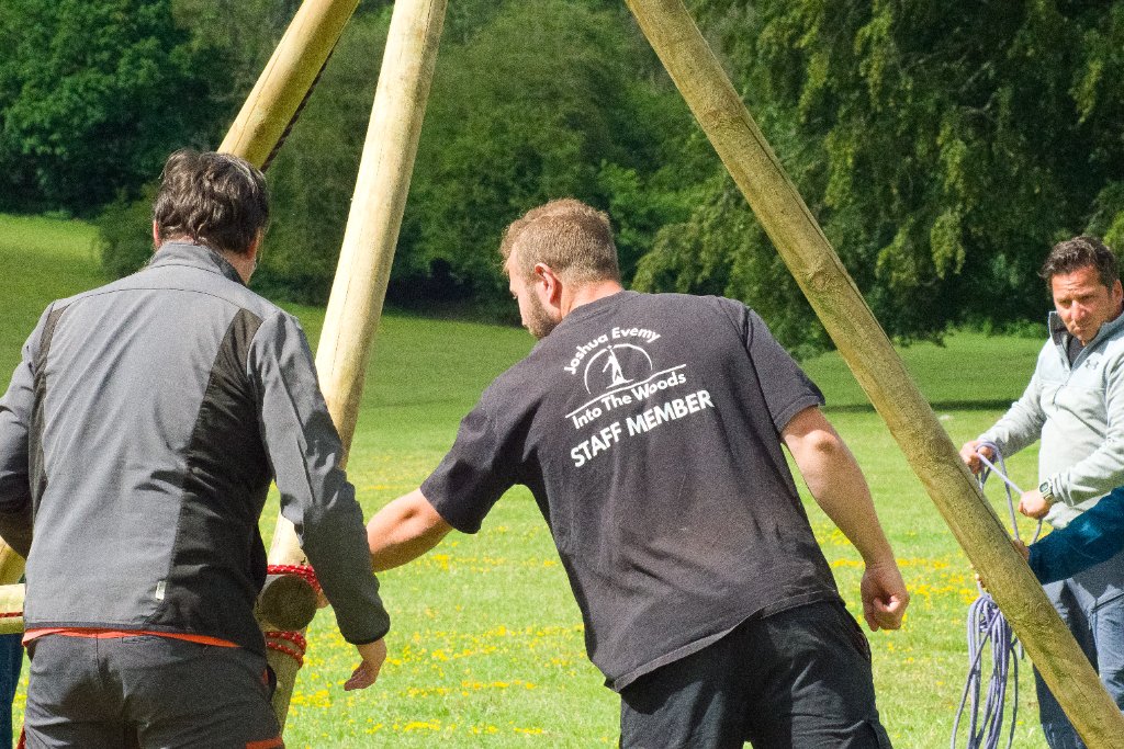 Into The Woods staff member raising a pioneering structure