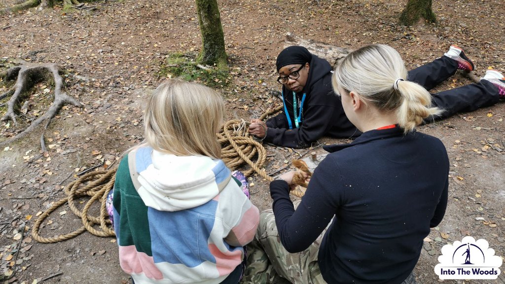 Command Tasks - group working with rope and knots on woodland floor