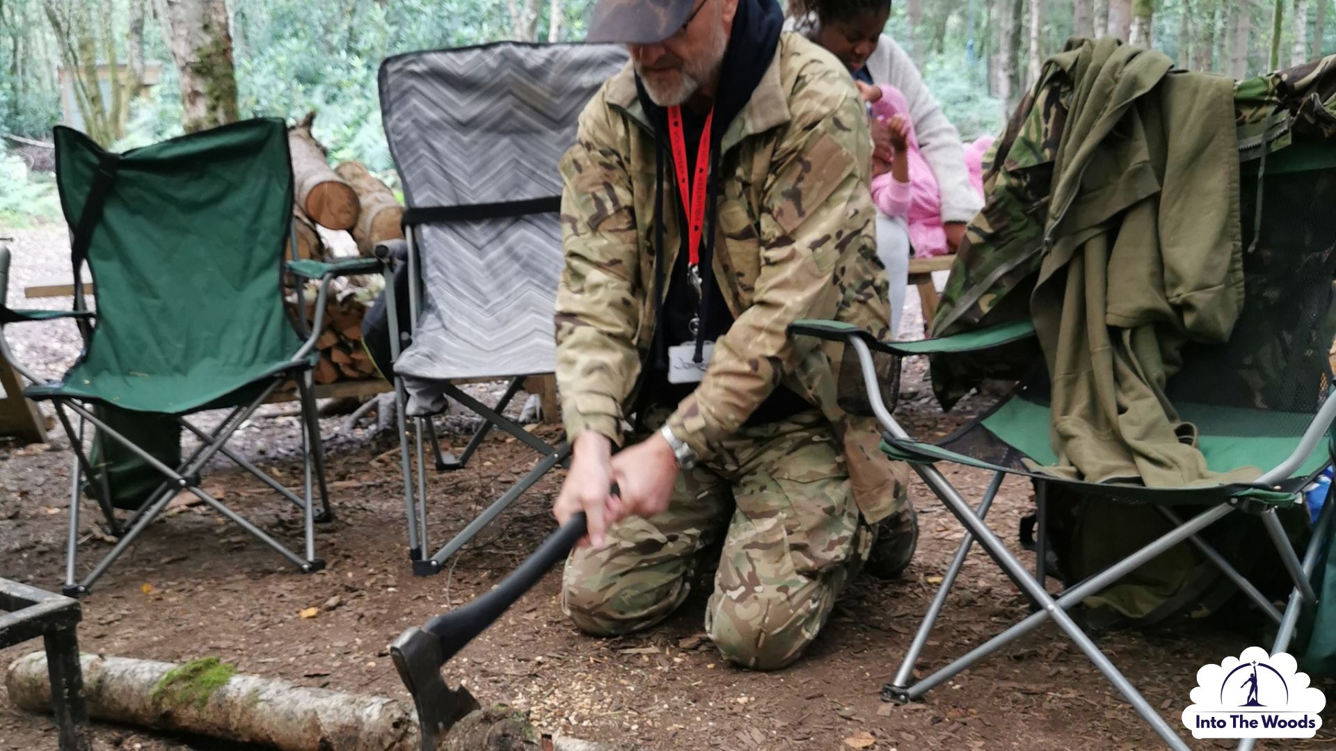 Tool Skills Kent - instructor demonstrating safe axe technique on a log